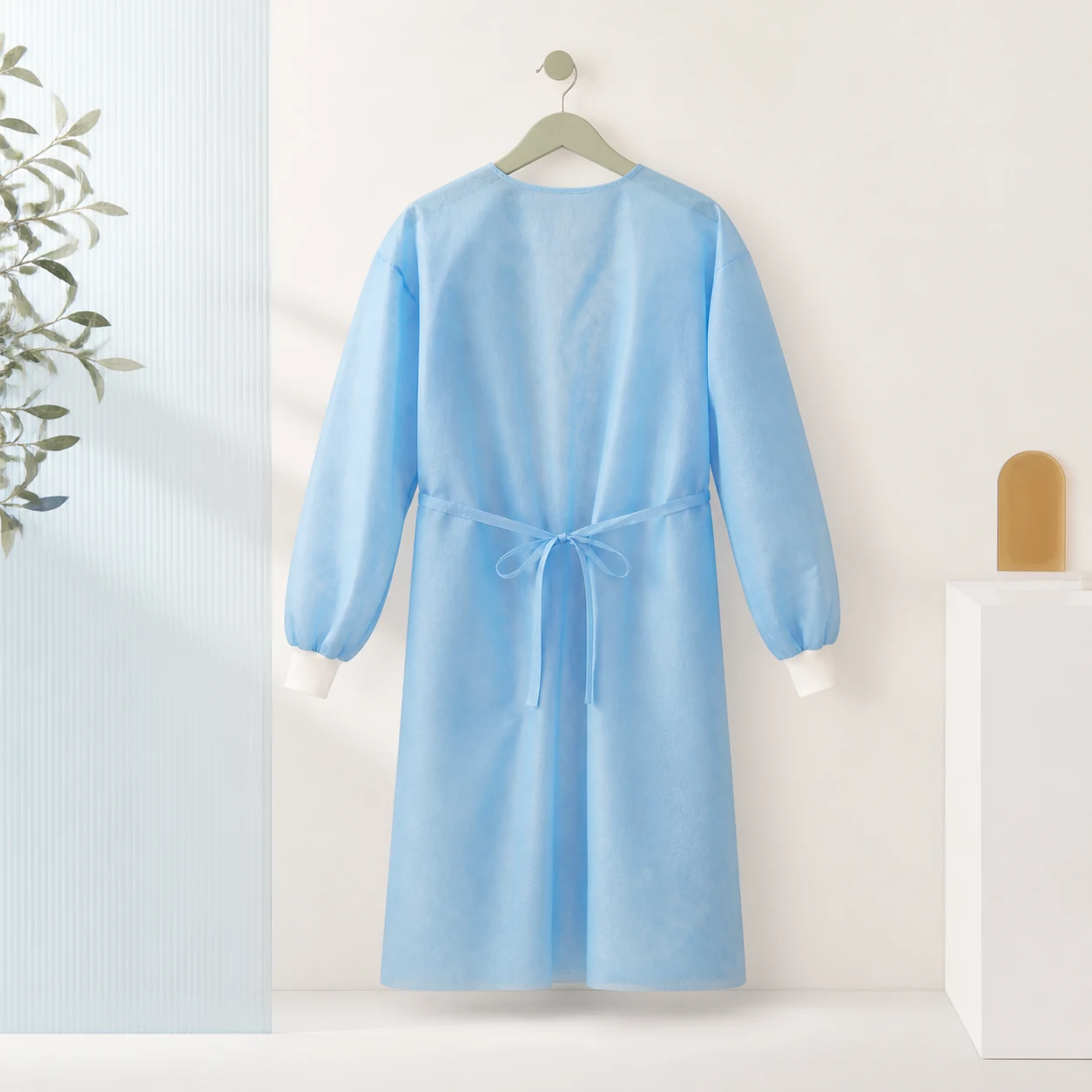 Pale blue non-woven protective gown